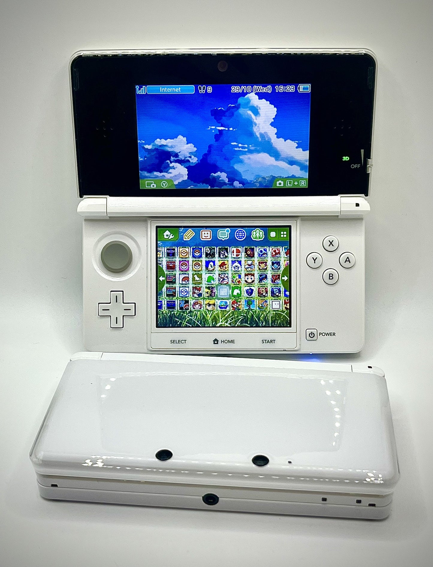 White gaming console with dual screens on a white background